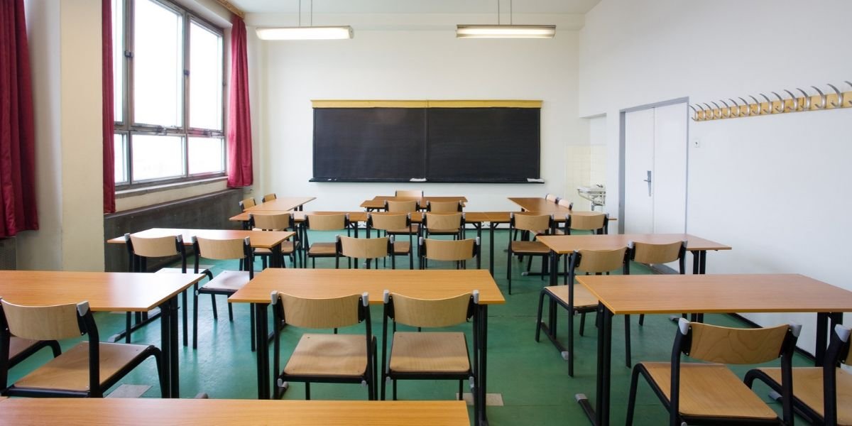 an empty classroom concept of cheap flights during school holidays