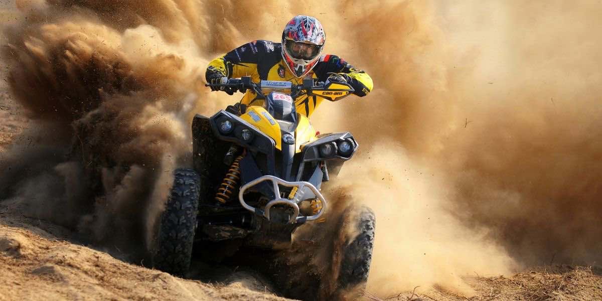 man on a dirt bike in a cloud of dirt