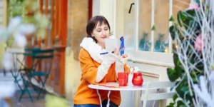 woman relaxing with a notebook at a cafe